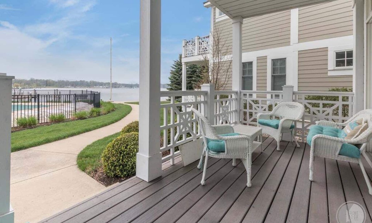 Saugatuck Condo | Discover comfort in Saugatuck at Lake Street Townhome #7, a 3BR retreat with pool views.