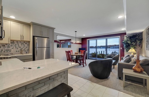Charlevoix Condo | 102-Edgewater Inn | Cozy Lakefront Inn | Pool, Hot Tub, Sauna | Full Kitchen
