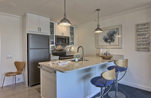 Boyne City Condo | 213 Water Street | Lake Charlevoix Views | Private Balcony & Beach Access