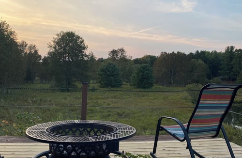 Grayling House | Ausable River waterfront 4-bed house in Grayling w/dock, patio, firepit, garage.