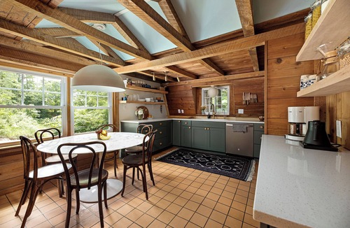 Maple City Cottage | Charming Hillside 3BR Cottage with snowmobile trailer parking