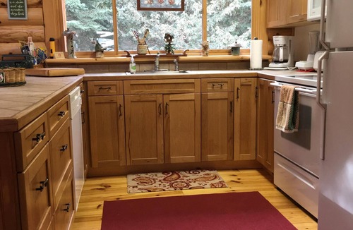 Boyne Falls Cabin | Charming Log House with WIFI Steps Away from Boyne River and enhanched cleaning.