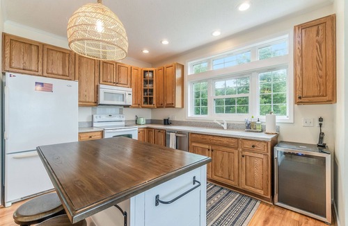 Lake Township Cottage | Contemporary Crystal Lake Beachfront Cottage