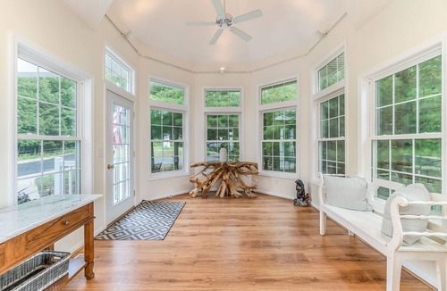 Lake Township Cottage | Contemporary Crystal Lake Beachfront Cottage