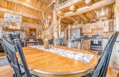 Thompsonville Cabin | Delightful Riverfront Cabin with Wood-Burning Fireplace and Gas Grill & Hot Tub
