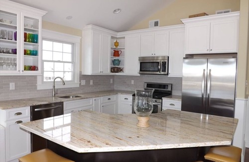 Avalon Condo | Enjoy the beautiful bay and sunset views from this top floor condo