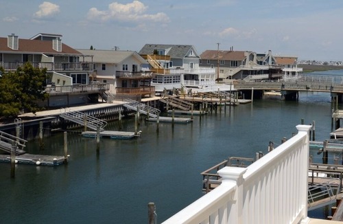 Avalon Condo | Enjoy the beautiful bay and sunset views from this top floor condo