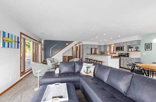 Saugatuck Apartment | Gorgeous Downtown Penthouse with 40' Waterfront Deck Overlooking Kalamazoo River & Mt. Baldhead! 3BR 2BA (Upper Level Unit)