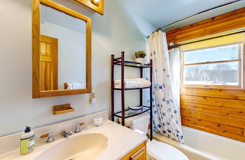 Meredith House | Idyllic lake retreat with beach access, firepit, wraparound porch, & great views