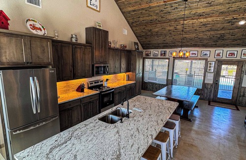 Sabinal House | NOLA styled 6-bedroom home in Concan. Sleeps 36 with AC, WiFi, Pool, Hot Tub