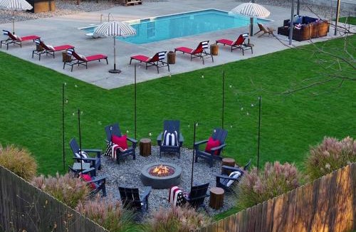 Muskegon House | Pine & Paddle Getaway Game Room Hot Tub Pool