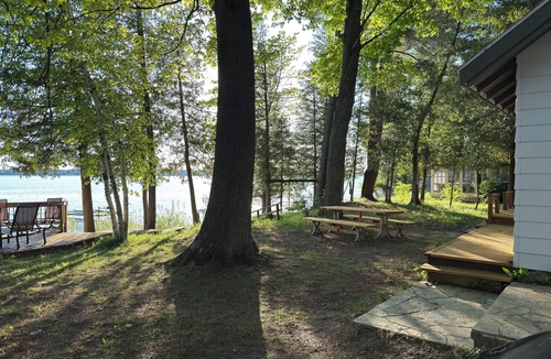 Alden Cottage | Private Sandy Beach on Torch Lake Cottage + Guest House Walk to Alden
