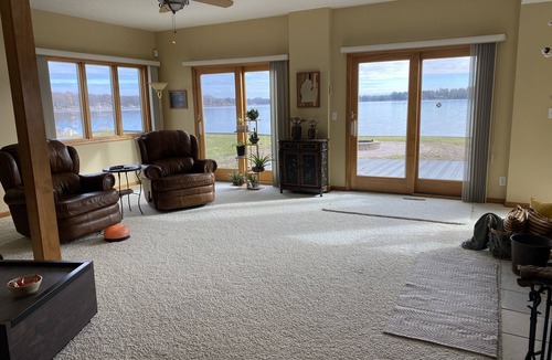 Lake House | Relax at the outdoor firepit or hot tub overlooking all-sports Eight Point Lake!