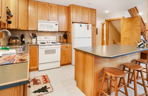 Thompsonville House | Riverfront home with deck, firepit, two fireplaces, W/D, bar, & two kayaks