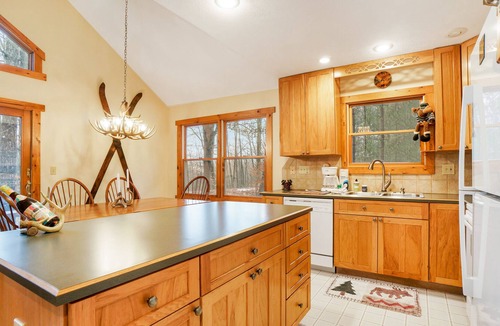 Thompsonville House | Riverfront home with deck, firepit, two fireplaces, W/D, bar, & two kayaks