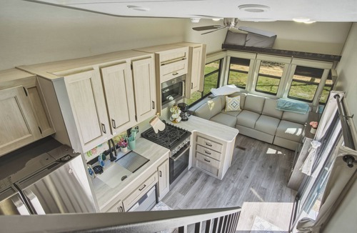 Fountain House | Round Lake Getaway Camper: Full Kitchen, 2 BR's, Dock, Pedal Boat Near Ludington