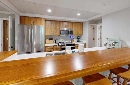 Maple City House | Secluded home with three kitchens, vaulted ceilings, washer/dryer, & patios