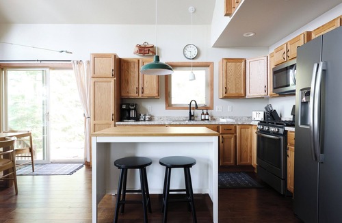 Eagle River House | Serene Lakefront Retreat: A/C, dock, canoe, kayaks