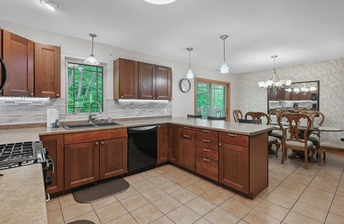 Mosinee Apartment | Stylish 2-Bedroom Upper-Townside Getaway I Firepit I Deck I Yard