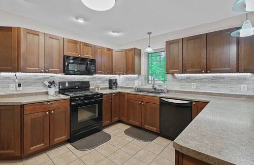 Mosinee Apartment | Stylish 2-Bedroom Upper-Townside Getaway I Firepit I Deck I Yard