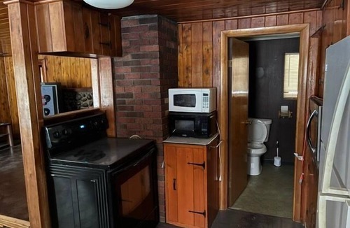 Grayling Cottage | This is a 4 bedroom, with three bathroom home. Located in the heart of Lovells with a short two track that leads to the river. Located only 3 minutes from the Lovells Riverside Tavern it offers a secluded get away for you and your friends.