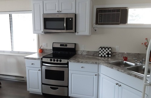 Rapid City Cottage | TORCH LAKE SANDBAR -directly across the street-