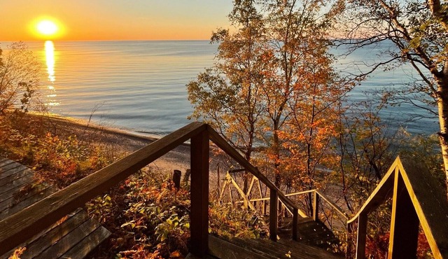 **Artistry view of Lake Superior with the allurement of Upper Entry Lighthouse *