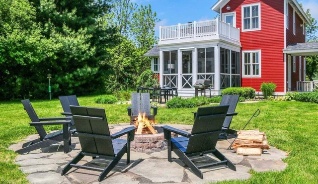Experience tranquility at The Red Farmhouse in secluded Fennville, MI, with 4 bedrooms.