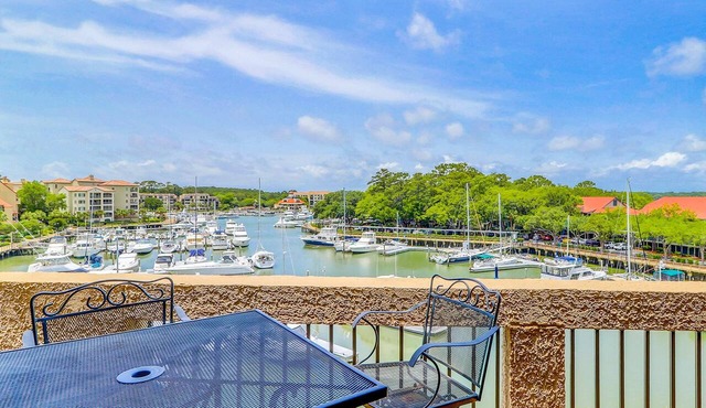 Penthouse living at Shelter Cove Marina with balcony, harbor view, pool & tennis