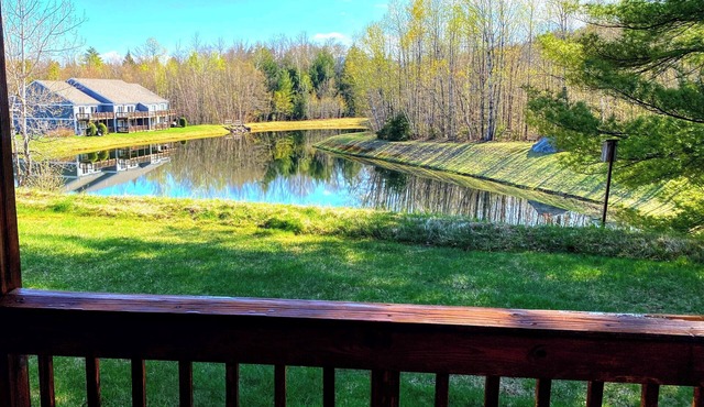 Serene pond views from this charming 2-bed White Mountains condo