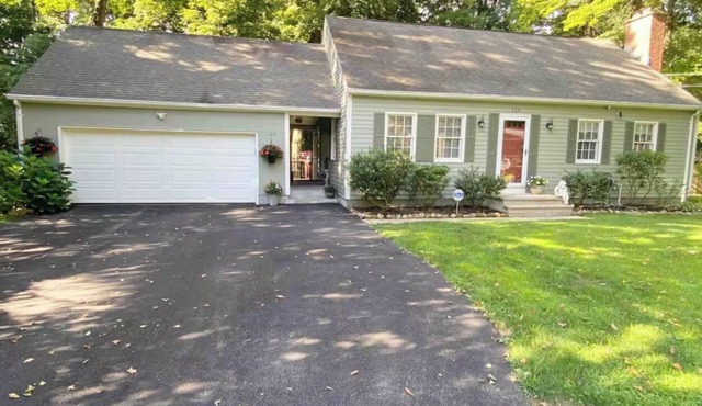 Spacious 4-bedroom house in Longmeadow with hot tub and central air.