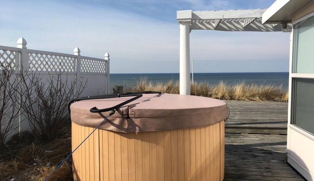 Stunning Lake Michigan views in our light, airy beachfront cottage. Sleeps 10.