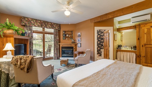 Woodward House Room with Fireplace and Patio
